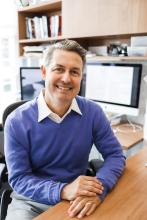 Man sitting at desk.