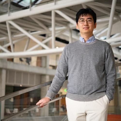 Man with hand on banister.