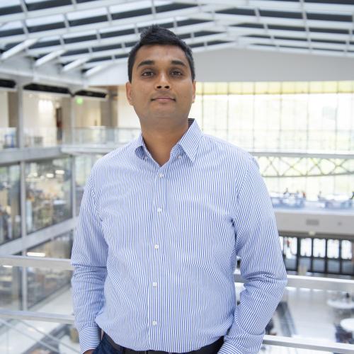 Man with hands in pockets.