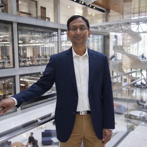 Man with hand on banister.