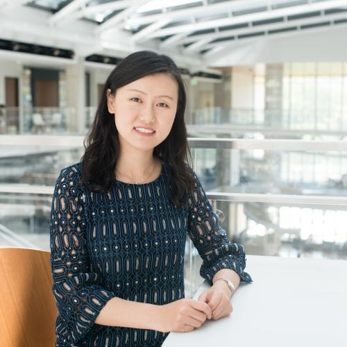 Woman sitting at table.