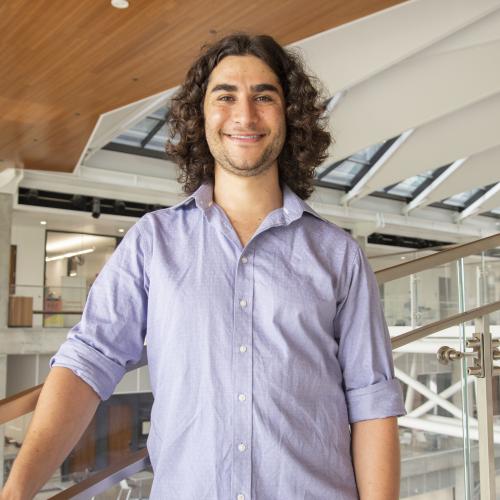Man with hand on banister.